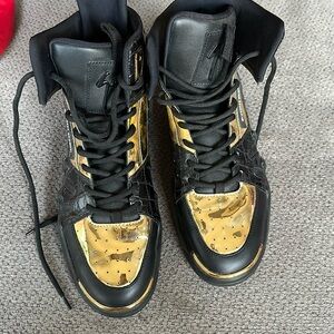 (Giuseppi)’s Black and gold high top sneakers